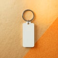 A pristine blank white rectangular keychain with a shiny metal ring offers an excellent versatile template for custom branding, Royalty Free Stock Photo