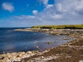 The pristine, deserted, rocky beach at Salt Wick on a calm day in summer - Yell, Shetland, UK Royalty Free Stock Photo