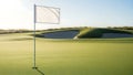 White flag on a golf course with a bunker in the background under a clear sky Royalty Free Stock Photo