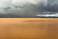 Pristine landscape with lake calm water and dramatic sky at morning