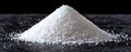 A pristine mound of granulated crystals, meticulously captured against a stark black backdrop. This highresolution image evokes