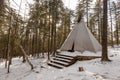 The pristine nature of the Zeya reserve. White chum wigwam stands in the middle of the snowy taiga Royalty Free Stock Photo