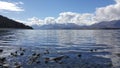 Peaceful landscape of blue Lake with astonishingly clear waters. Royalty Free Stock Photo