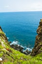 Pristine sea with rocky cliff at Dai Lanh cape point, Mui Dien, Phu Yen province, easternmost of Viet nam. Royalty Free Stock Photo