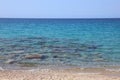 pristine sea with the stony sand of the Mediterranean island in Royalty Free Stock Photo