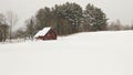 Pristine snowy field and red barn Royalty Free Stock Photo