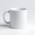 Simple white ceramic mug with handle, isolated for branding mockups and design presentations on white background Royalty Free Stock Photo