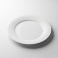 A Single White Ceramic Plate Centered on a White Background with Subtle Shadow dish tableware Royalty Free Stock Photo