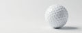 A pristine white golf ball on a pure white backdrop , macro, marketing Royalty Free Stock Photo