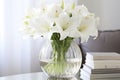 pristine white lilies in a clear vase depicting purity