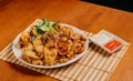 A white plate with fried shrimps near a white and red sauce Royalty Free Stock Photo