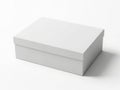 A pristine white rectangular box with a lid sitting on a plain surface Royalty Free Stock Photo
