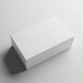 A pristine white rectangular box standing alone on a gray surface Royalty Free Stock Photo