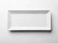 A pristine white rectangular plate against a plain background Royalty Free Stock Photo