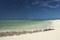 Pristine white sandy beach with rocks at Herron island