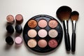 On a pristine white table, makeup set featuring brush and powder Royalty Free Stock Photo