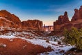 Pristine winter snowy view of `Park Avenue` in Arches National Park at sunrise in Moab Utah Royalty Free Stock Photo