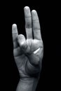 Prithvi mudra demonstrated by male hand isolated on black background. Royalty Free Stock Photo