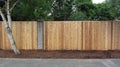 Privacy cedar fence with brick accents showing horizontal