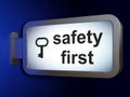 Privacy concept: Safety First and Key on billboard background Royalty Free Stock Photo