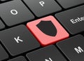 Privacy concept: Shield on computer keyboard background Royalty Free Stock Photo