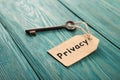 privacy concept - vintage key with tag with inscription Royalty Free Stock Photo