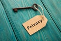 privacy concept - vintage key with tag with inscription Royalty Free Stock Photo