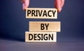 Privacy by design symbol. Concept words Privacy by design on wooden blocks on a beautiful grey table grey background. Businessman Royalty Free Stock Photo