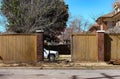 Privacy fence repair - Truck parked inside yard where a wreck has occured and fence is being rebuilt