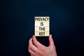 Privacy is the key symbol. Concept words Privacy is the key on wooden blocks on a beautiful black table black background. Royalty Free Stock Photo