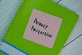 Privacy Protection write on sticky notes isolated on Wooden Table Royalty Free Stock Photo