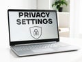 Privacy settings is shown using the text and photo of the laptop