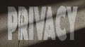 Privacy Written on a Repaired Concrete Wall with Gate Shadow Royalty Free Stock Photo