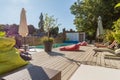 Private Bed and Breakfast beautiful , swimming pool view from the veranda, Wooden table and chairs Royalty Free Stock Photo