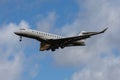 Private Charter Bombardier Global 7500 isolated in the air with clouds in the background