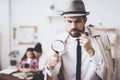 Private detective agency. Man is posing with magnifying glass, woman is holding her daughter. Royalty Free Stock Photo