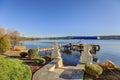 Private dock with jet ski lifts and covered boat lift, Lake Washington. Royalty Free Stock Photo