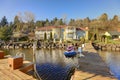 Private dock with jet ski lifts and covered boat lift, Lake Washington. Royalty Free Stock Photo