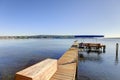 Private dock with jet ski lifts and covered boat lift, Lake Washington. Royalty Free Stock Photo