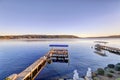 Private dock with jet ski lifts and covered boat lift, Lake Washington. Royalty Free Stock Photo