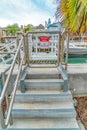 Private dock stairs with No Trespassing sign at canal in Long Beach California Royalty Free Stock Photo