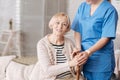 Private doctor taking care of elderly patient