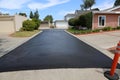 Private drive way, street rehabilitation and slurry seal project finished with crews expertly applying the slurry seal. Re- Royalty Free Stock Photo