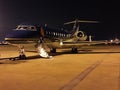 Private Global Express ready for boarding at night Royalty Free Stock Photo