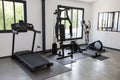 Private gym at home interior with different sport exercise equipment Royalty Free Stock Photo