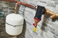 Plumbing service. copper pipeline and expansion vessel of a heating system in boiler room Royalty Free Stock Photo