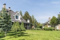 Private house with its beautiful garden in a rural area under blue sky Royalty Free Stock Photo