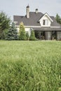 Private house and its garden under beautiful sky Royalty Free Stock Photo