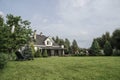 Private house and its garden under beautiful sky Royalty Free Stock Photo