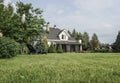 Private house and its garden under beautiful sky Royalty Free Stock Photo